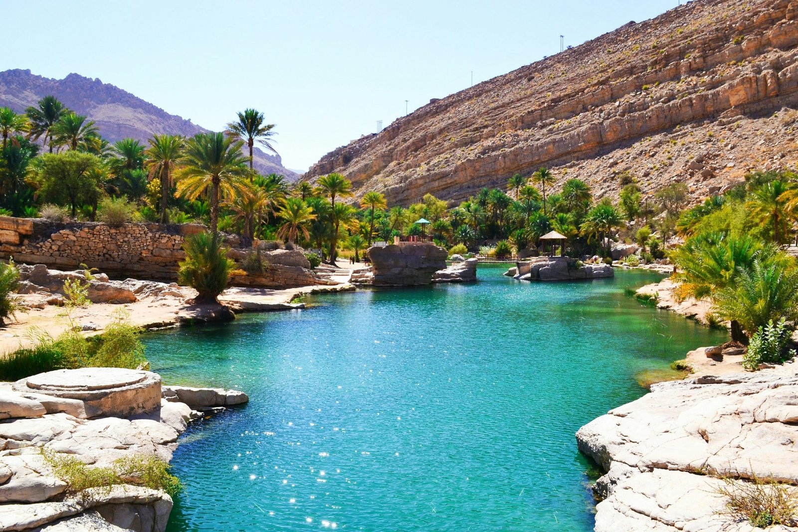 Turquoise water and palm trees in a wadi in Oman